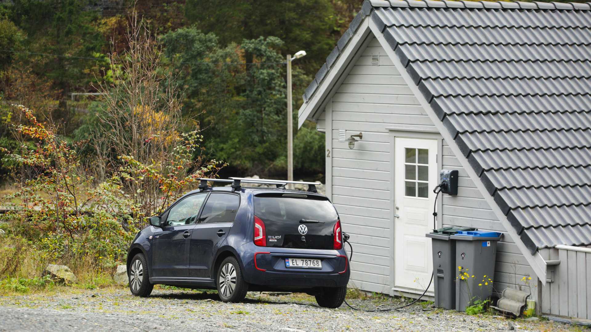 VW E-up at charging station attached to house in Bergen Norway